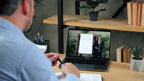 Man at Home Office Study Tells Teacher Online Video Call Chat Webcam Laptop