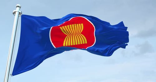 Waving ASEAN Flag Against Blue Sky