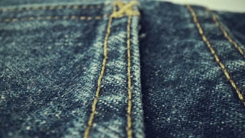 Blue Denim Fabric Close Up With Stitching