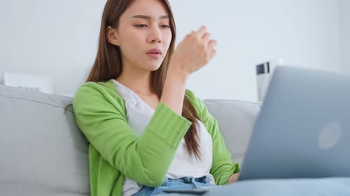 Stressed Woman Working on Laptop at Home