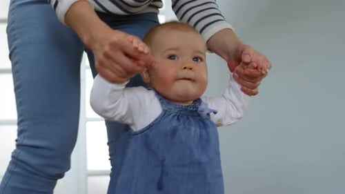 Adorable Baby Taking First Steps at Home