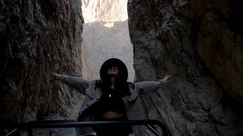 Adventurous Woman Enjoying Scenic Canyon Ride