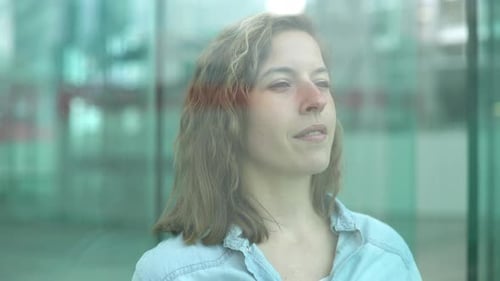 Woman Behind Glass Window Looking Out
