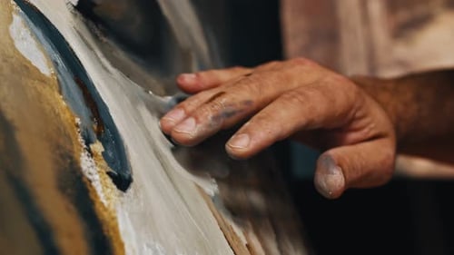 Painter Using His Hands To Creat an Oil Painting Masterpiece in Art Studio