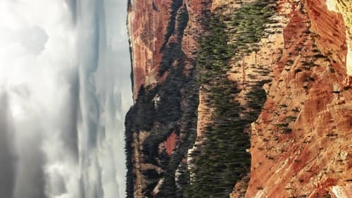 Beautiful time lapse of a red rock canyon with dramatic storm clouds overhead in HORIZONTAL ORIENTAT