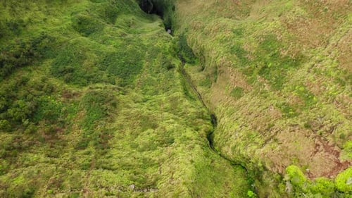 Epic Aerial View Over Hawaiian Coastal Landscape at a Sunset. Volcanic Rocks and Pacific Ocean