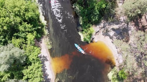 Kayaking and Canoeing Along the Riverbed Aerial View. Rafting. Tracking a Boat