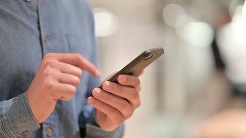 Hands Using a Mobile Phone