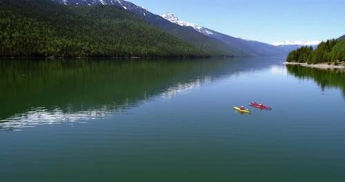 People kayaking in lake 4k