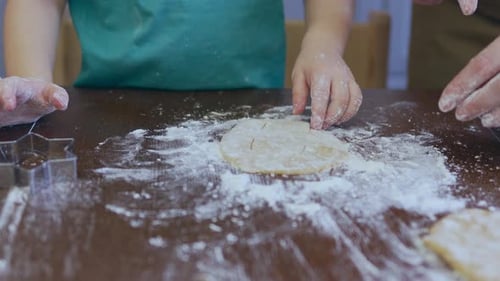 Little Child Boy and Mother Cooking Biscuits Together Pressing Out Dough Pastry