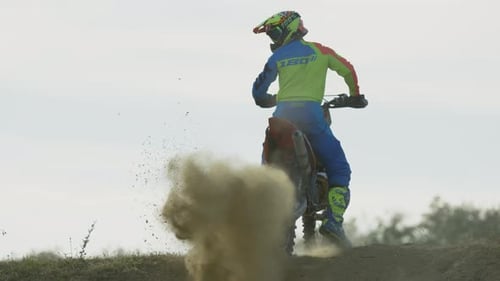 Motocross Rider Kicks Up Cloud of Dust
