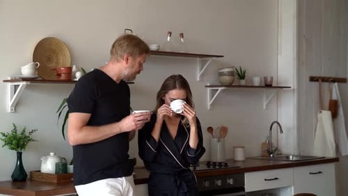 Couple Drinking Morning Coffee in Bright Kitchen