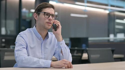 Young Man Talking on Phone