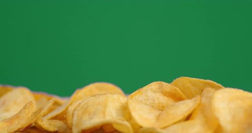 Golden Potato Chips on Green Screen Background