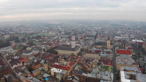 Flight Above the Roofs on Sunrise. Old European City. Ukraine Lviv City
