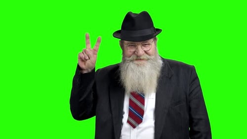 Man with Beard Makes Peace Sign on Green Screen