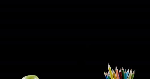 Books Apple and Pencils on Desk for Education