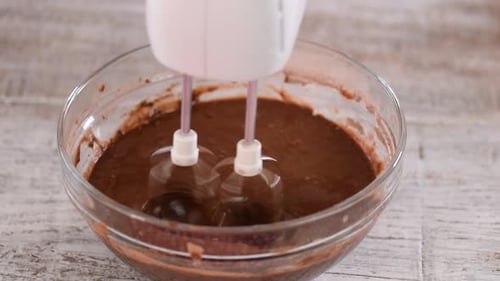 Chocolate Batter Mixed in Glass Bowl