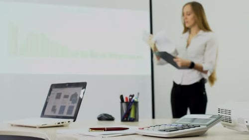 Woman Giving a Presentation in an Office Setting