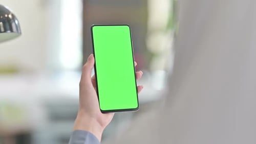 Rear View of Arab Woman Using Smartphone with Chroma Key Screen