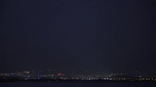 Lightning Strikes Over the City at Night