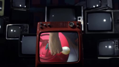 Vintage TV Explodes With Man Inflating Balloon on Screen - Close Up
