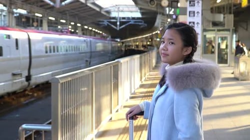 Asian Girl Waiting Express Train On Railway Station
