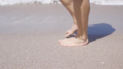 Running On The Beach Outdoors In Slow Motion.