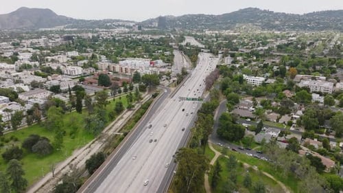 Los Angeles Freeway, Drone Aerial Shot of Busy California Highway in the Daytime, Mountains on Horiz
