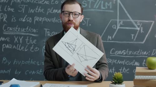 Portrait of College Teacher Having Online Lesson Explaining Maths Drawings in Classroom with