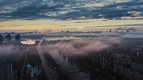 Aerial View of City After Rain Cloudy Sky Smog Residential Area Cars Driving Along Streets Next to