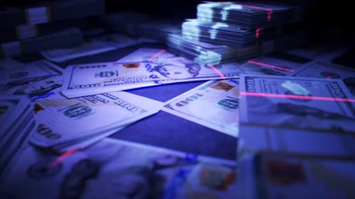 US Dollar Bills Verifying Authenticity with UV Light and Laser Scan
