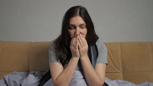 Woman Sick in Bed with Cold or Flu
