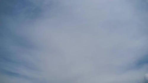 Clouds Moving in Bright Blue Sky