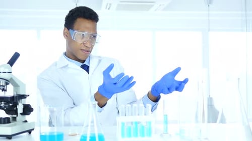 Young Adult Scientist Explains Scientific Processes in Laboratory