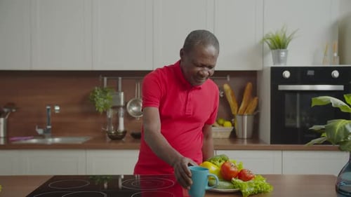 Senior Man Experiences Heart Attack in Kitchen