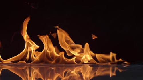 Abstract Flames Flickering Horizontally on Dark Background