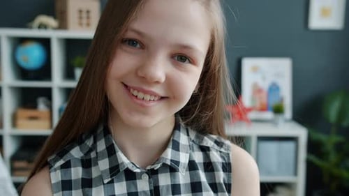 Preteen Girl Smiling Portrait in a Home Studio