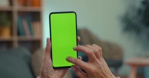 Woman Swiping Up and Tapping on Chroma Key Screen of Mobile