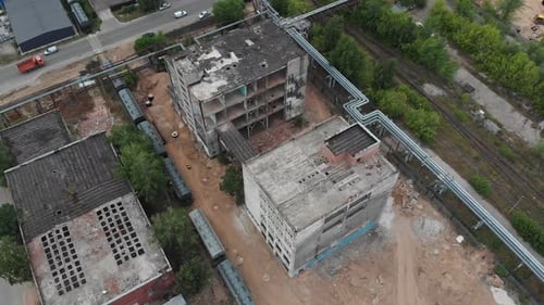 Two Empty Abandoned Buildings with a Bridge Between - Outside the City