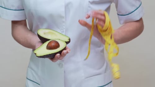 Ernährungsberater Doktor Healthy Lifestyle Concept - Mit Bio-Avocado-Früchten und