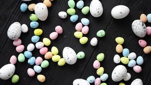 Colorful Pastel Easter Eggs on Black Wood