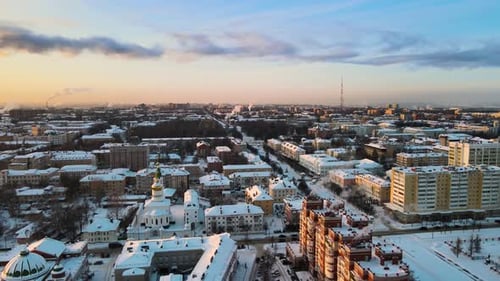 Snowy Cityscape Aerial at Sunrise in Winter