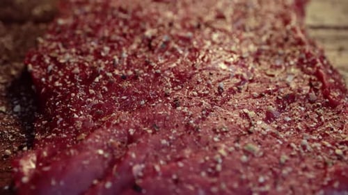 Seasoned Raw Meat Close-Up on Wooden Surface
