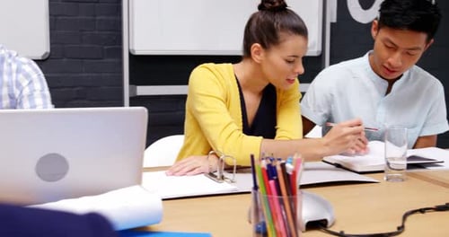 Office Meeting With Colleagues Discussing Ideas Together