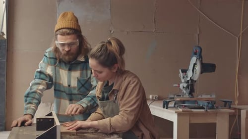 Two Joiners Working Together in Joinery Workshop