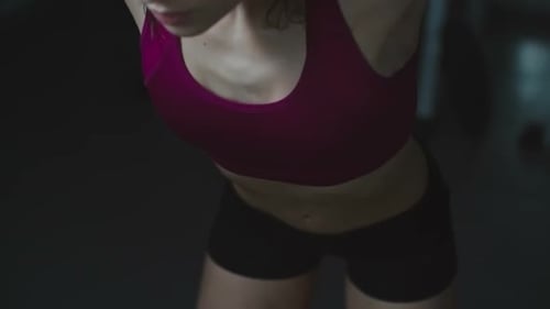 Woman Working Out in Gym on Cable Machine