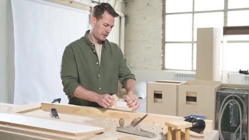 Male Woodworker Working in Workshop on Wood Create Product Made of Wood