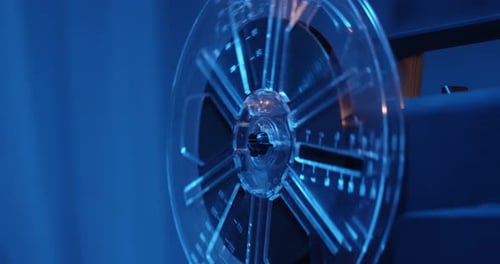 Antique 8mm Film Projector Reel Spinning Close Up