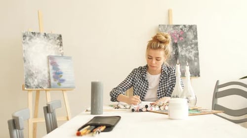 Woman Painting Art at a Table at Home